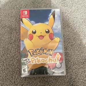 brand new with plastic pokémon let’s go pikachu! nintendo switch game